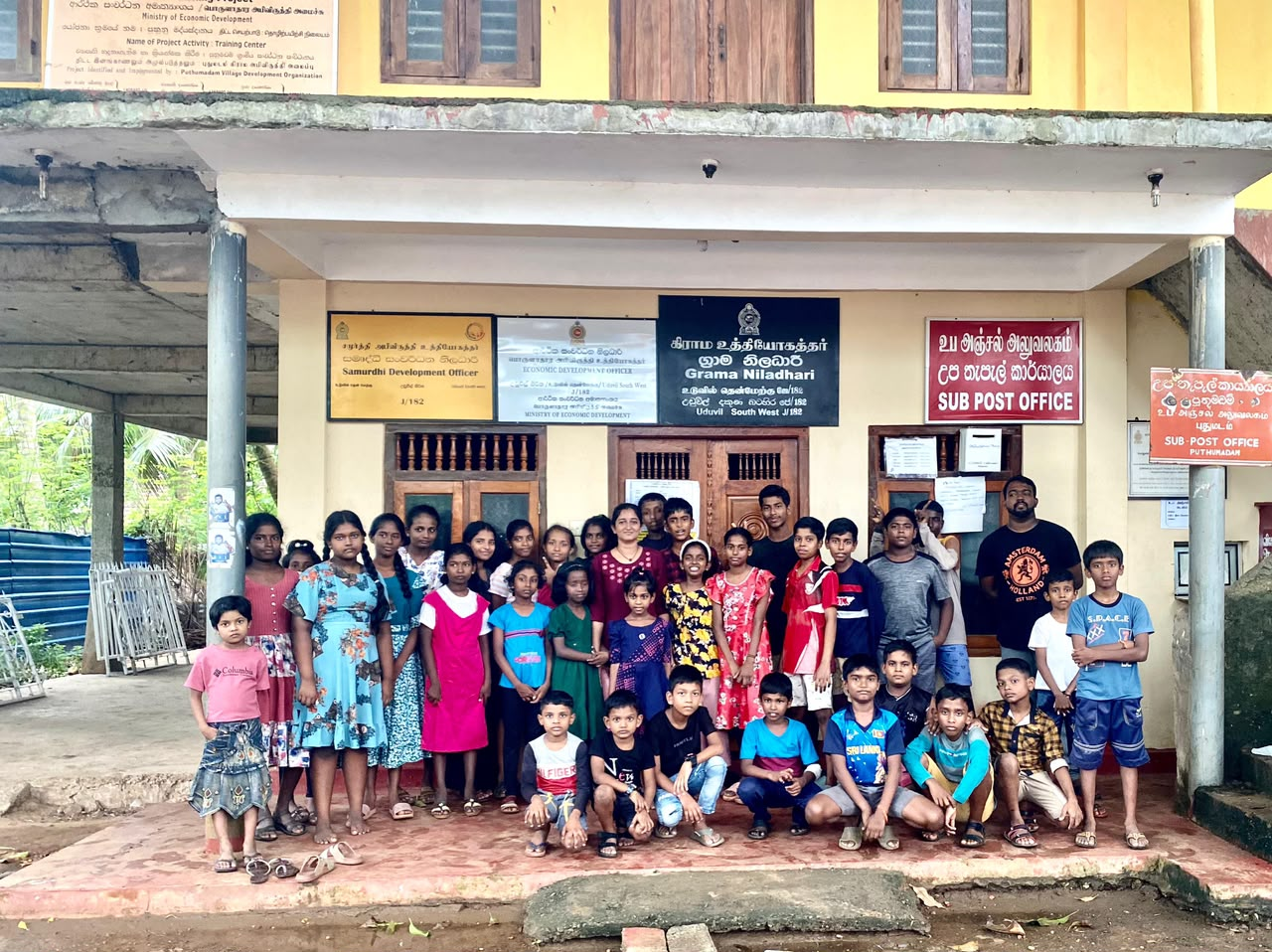 CPYE team and children gathered together in the community