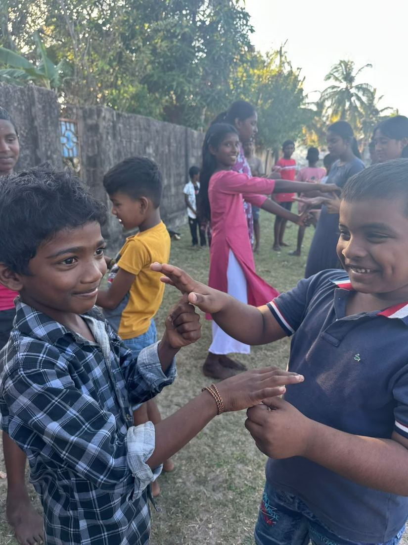 Children taking part in an outdoor team-building game